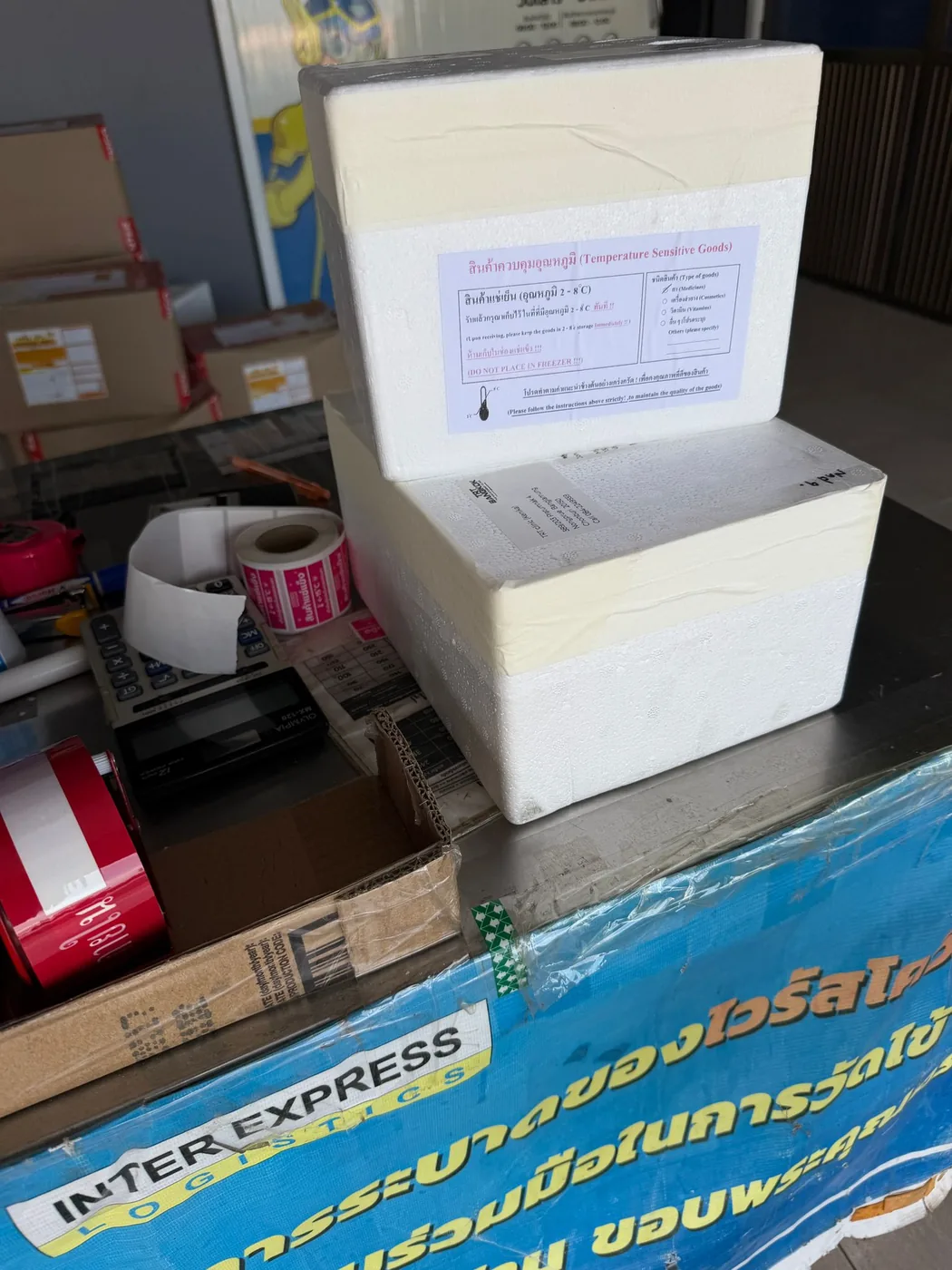 GLP-1 weight-loss medication packed cold from the TRT Bangkok clinic fridge into an insulated 2-8C cold-chain shipment box for nationwide delivery
